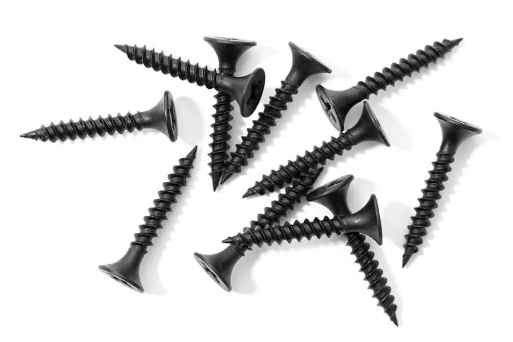 Black Oxide Coating - A Group of Drywall screws isolated on white background that have been black oside coated