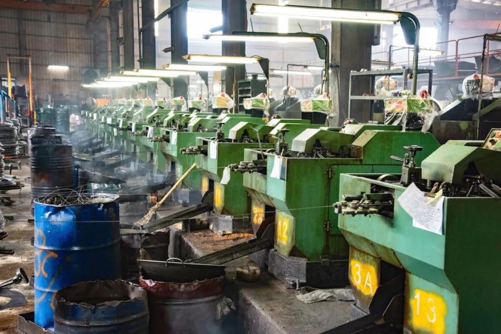 Cold forming screw machines in a factory in Asia of a screw manufacturer